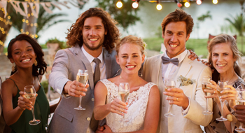 a bride and groom surrounded by their bridesmaids and groomsmen