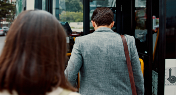business people boarding a bus