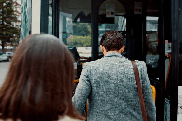 business people board a charter bus 